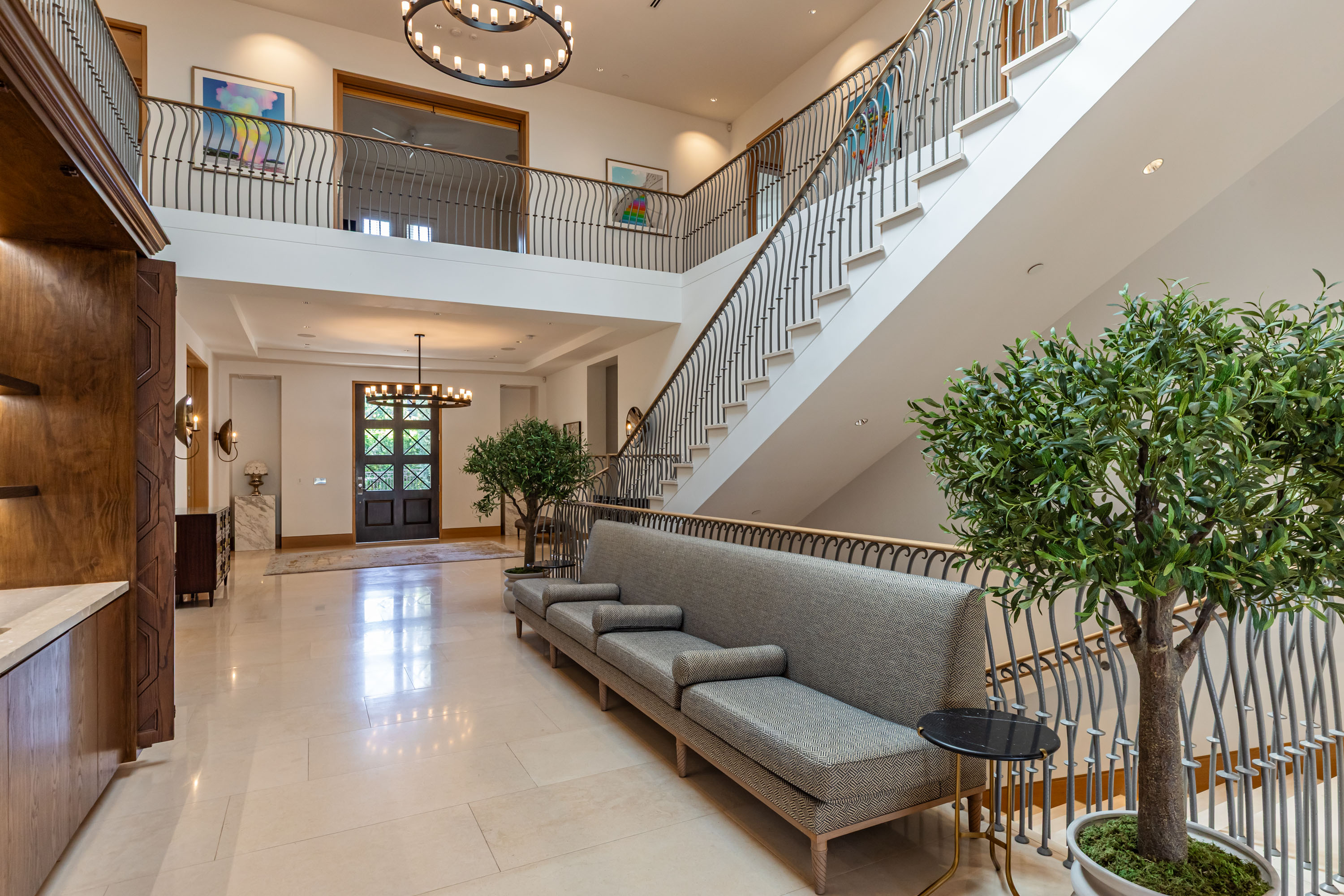 Double-height entry hall with grand staircase