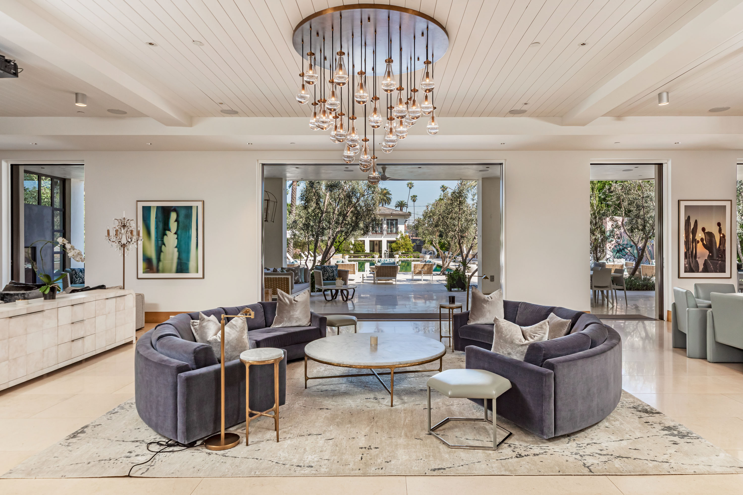 Indoor-outdoor living opening to the pool terrace