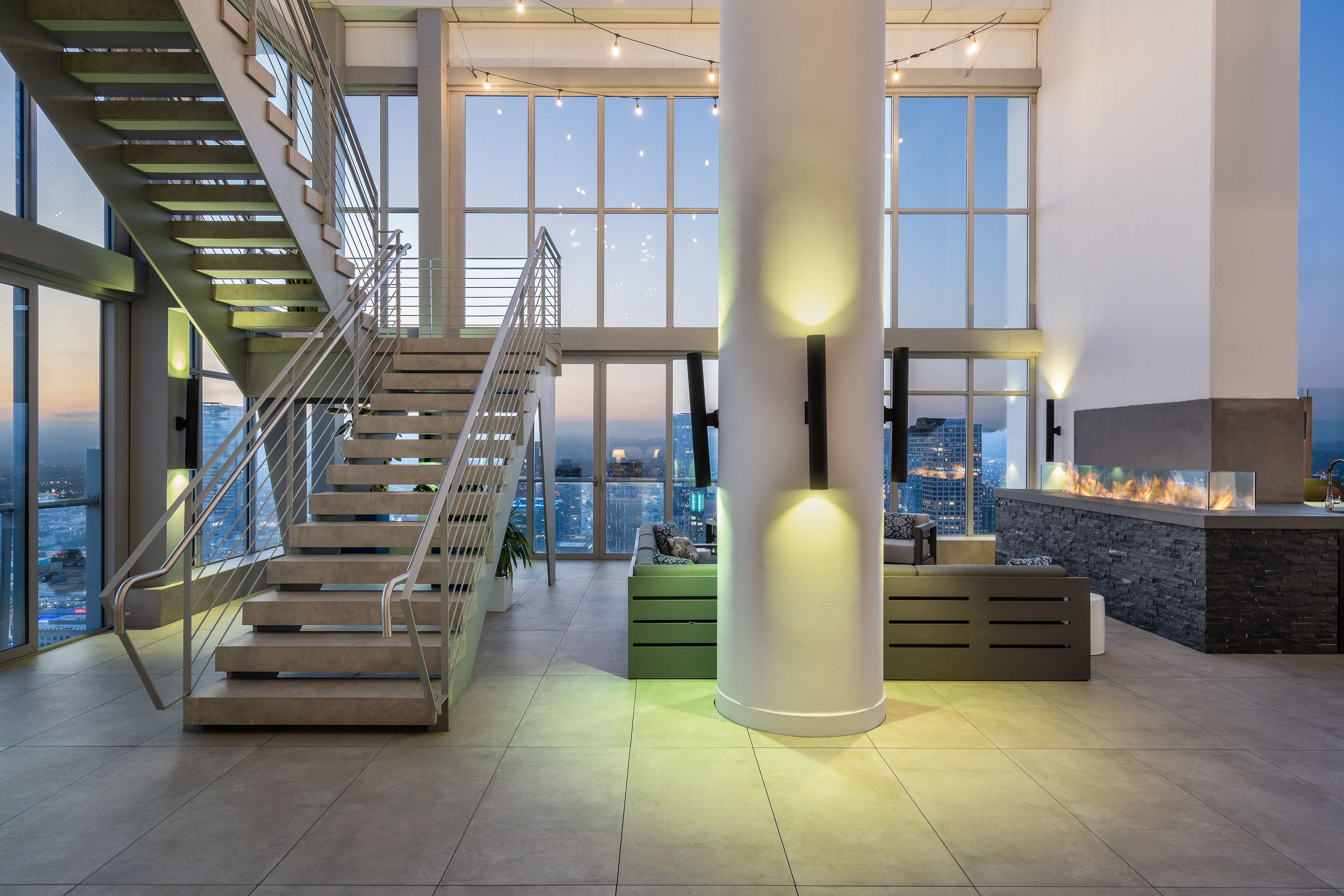 825 S. Hill great room at twilight with floating staircase
