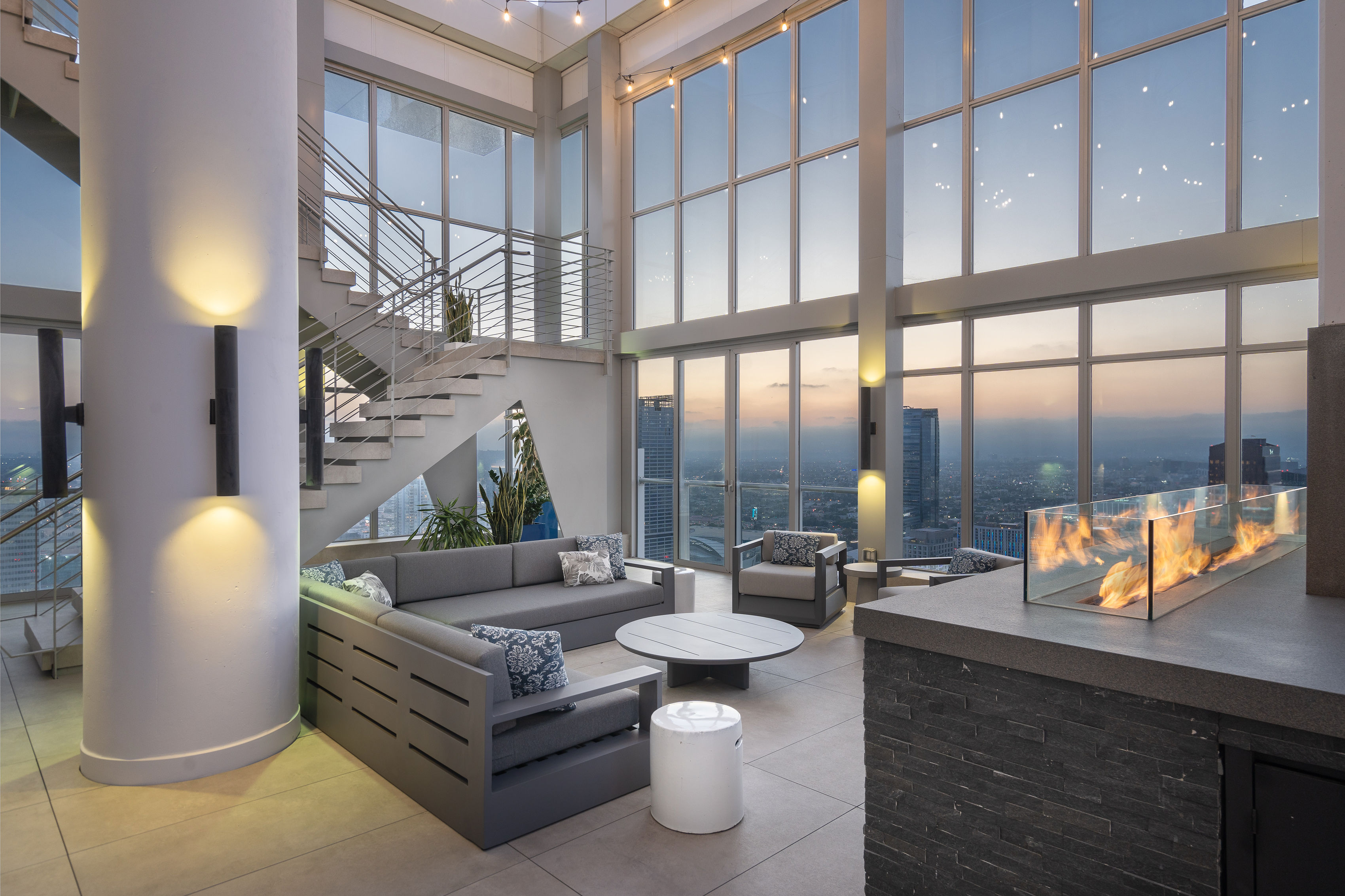 825 S. Hill rooftop pool at sunset over Downtown LA