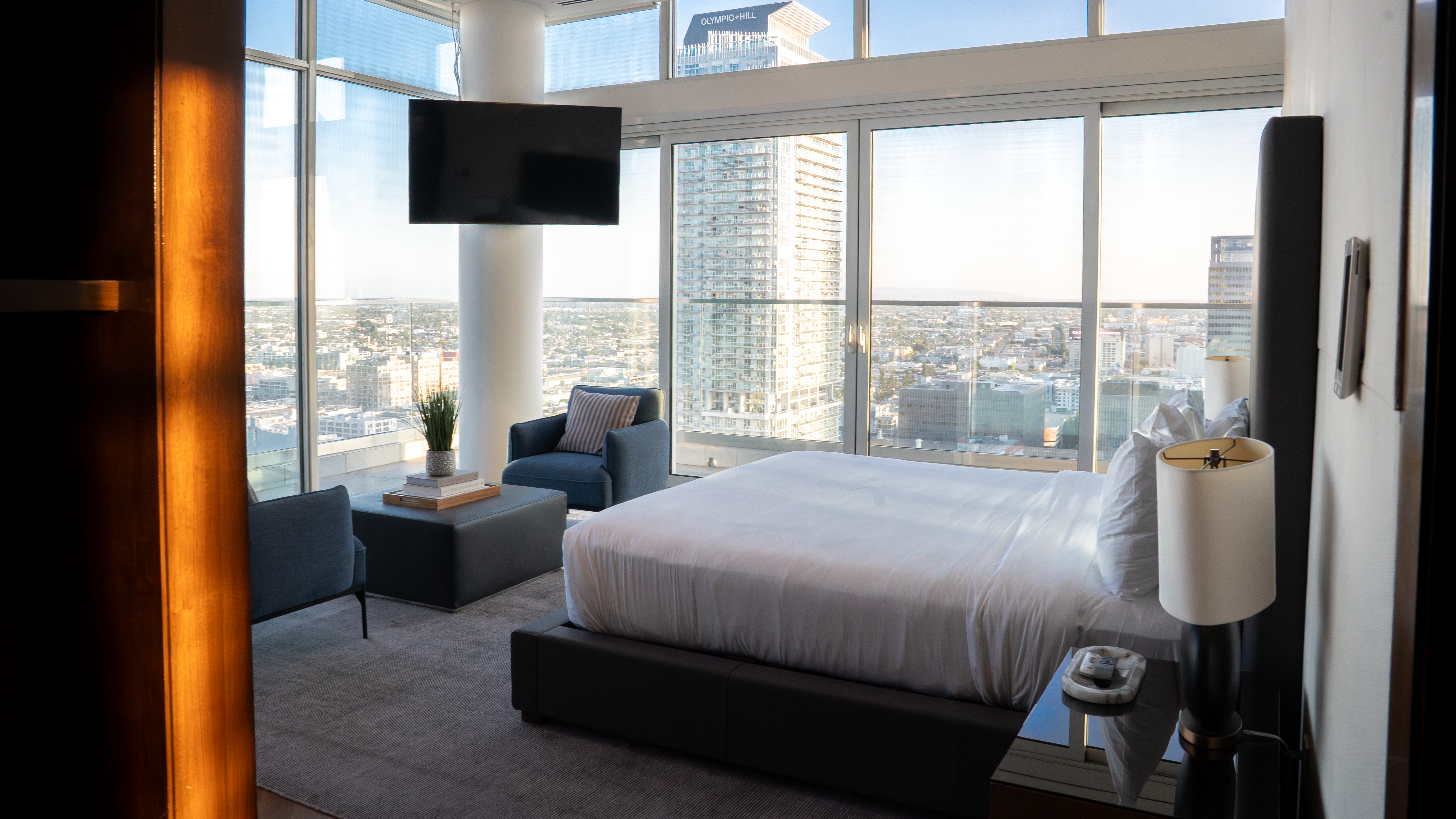 888 S. Olive primary bedroom with floor-to-ceiling windows and city view