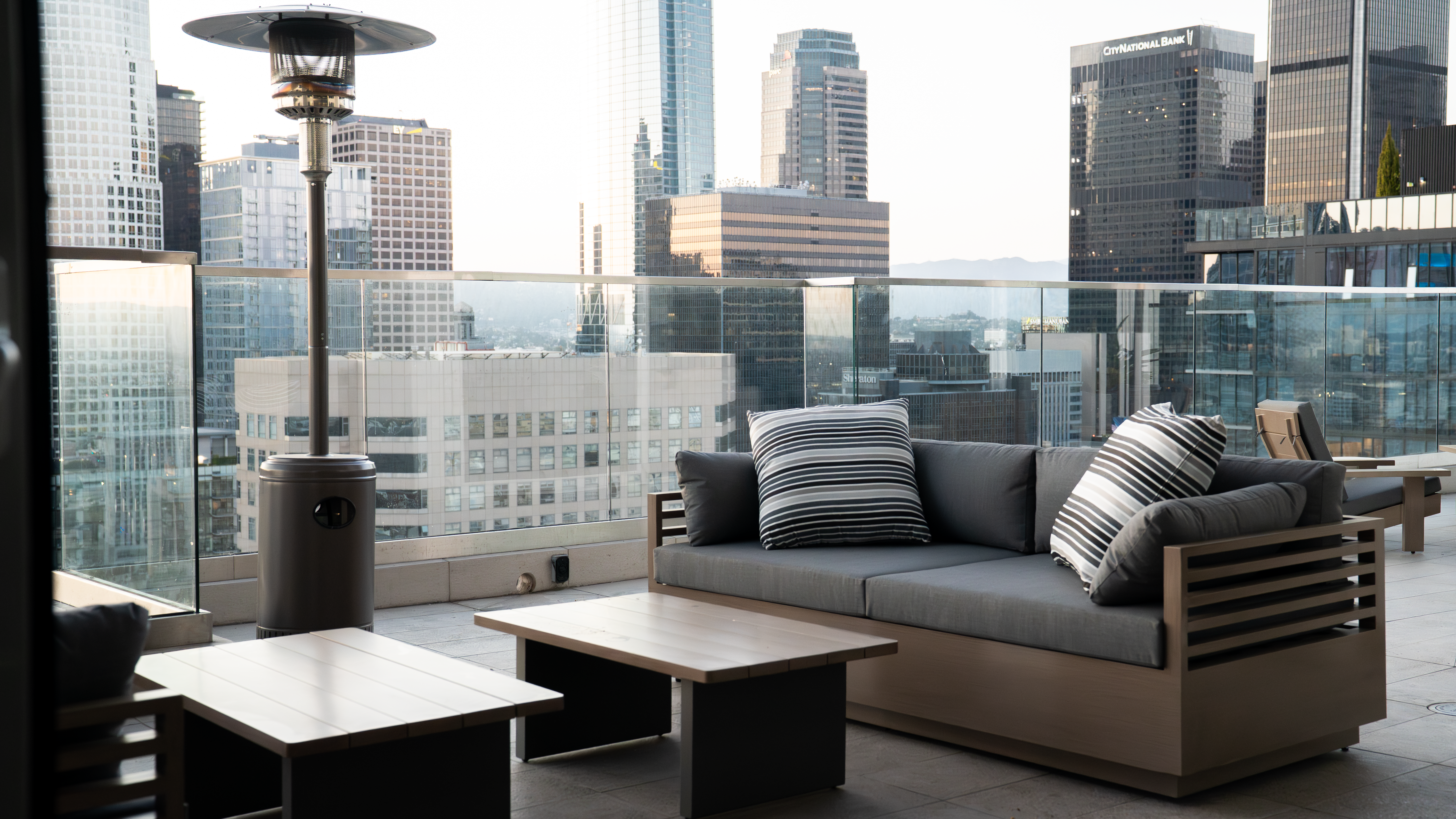 888 S. Olive rooftop lounge with heater and skyline