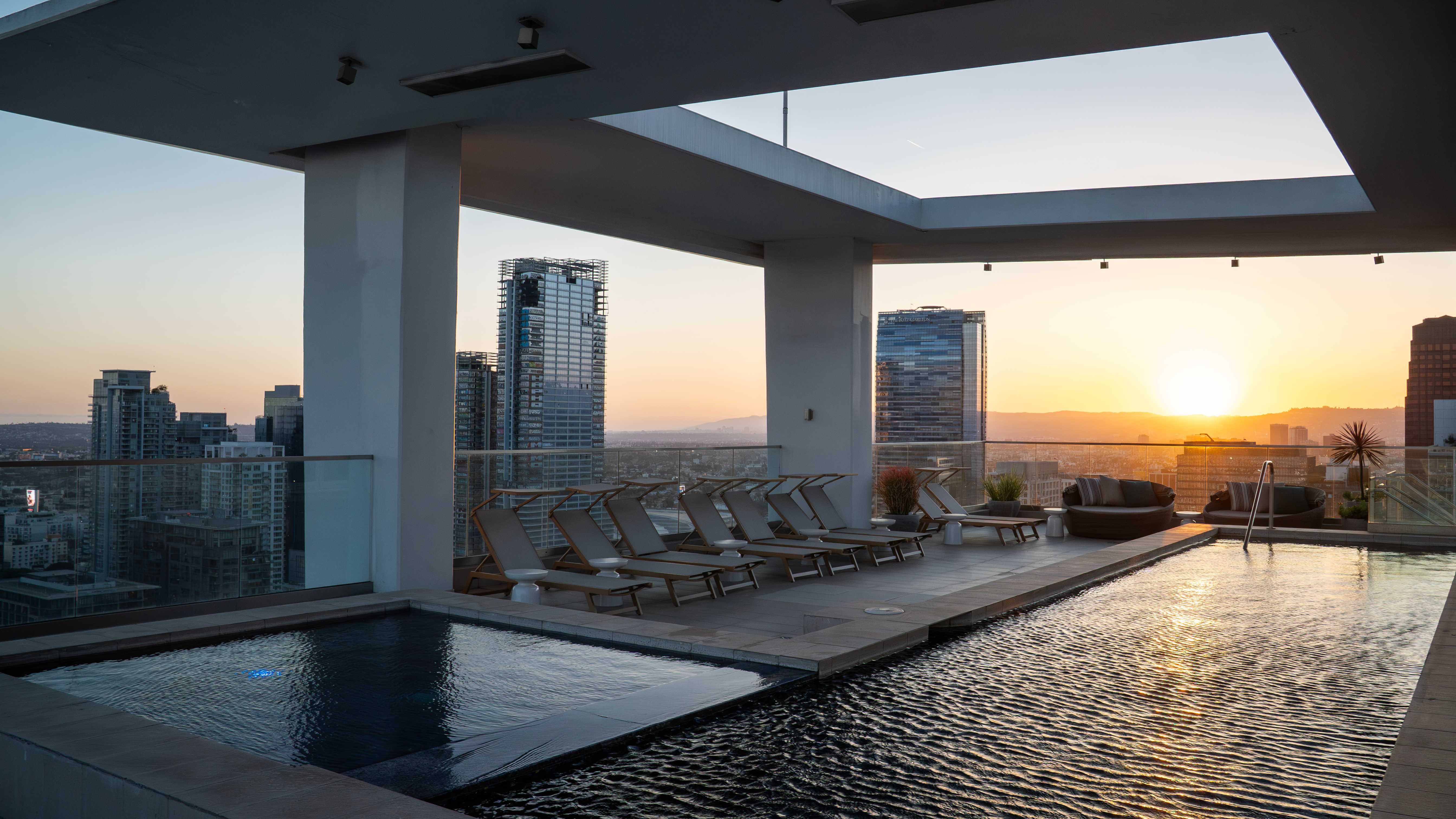 888 S. Olive rooftop infinity pool at sunset over Downtown LA